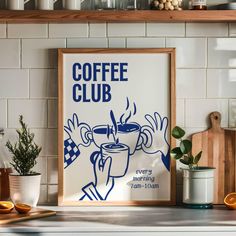 there is a coffee poster on the wall in the kitchen with other items around it