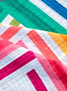 The Zoe Quilt Pattern is a quick, fun project for showing off your favorite fabrics. The pattern works beautifully with a selection of rainbow fabrics, but is also great for working from your stash or using your favorite fabric collection. SizesBaby Size - 45" x 45"Lap Size - 56" x 67"Twin Size - 79" x 90" Skill LevelIntermediate - the trickiest part of this pattern is trimming your quilt. Coloring SheetA coloring sheet for planning your fabrics can be downloaded here. A paper version of the pat Twin Quilt Pattern, Modern Quilt Blocks, Bright Quilts, Modern Baby Quilt, Solid Quilt, Spring Quilts, Scrappy Quilt Patterns, Quilt Sewing Patterns, Geometric Quilt