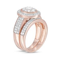 With vintage-inspired details, this diamond bridal set speaks to her love of things old and new. Created in precious 10K rose gold, the dazzling engagement ring showcases an oval-shaped composite of diamonds - the largest a 1/6 ct. stone. The frame shimmers with diamonds and intricate milgrain while milgrain borders surround ribbons of diamonds along the triple-row shank. On your wedding day, the double-row wedding band - lined with diamonds and milgrain detailing - completes her ensemble. Radiant with 1-1/3 cts. t.w. of diamonds and a brilliant buffed luster, this bridal set is a bold way to celebrate your commitment. Classic Rose Gold Wedding Rings With Pave Setting, Rose Gold Bridal Sets Fine Jewelry, Rose Gold Diamond Bridal Sets In Fine Jewelry, Rose Gold Diamond Bridal Set, Rose Gold Jewelry With Pave Setting For Wedding, Rose Gold Round Cut Bridal Sets For Anniversary, Anniversary Rose Gold Round Cut Bridal Sets, Anniversary Rose Gold Bridal Sets Round Cut, Rose Gold Brilliant Cut Bridal Set For Wedding