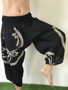 "Male Model Tall 5'9\" Waist 34\" Mens Japanese Samurai Style Japanese Casual, Harem Baggy Hakama cotton Pants Samurai Pants - elastic waistband Fits all! Unisex pants These beautiful casual pants is unique & comfortable to wear Handmade with a very lovely pattern, it is easy to wear and great for many occasions. One size fits most. These pants are great for many different activities like traveling, dancing, going to festivals, rock climbing, yoga, meditation, massage, working out, martial a Traditional Harem Pants For Meditation, Traditional Wide Leg Harem Pants For Meditation, Traditional Black Wide Leg Bottoms, Traditional Relaxed Fit Harem Pants For Yoga, Traditional Black Harem Pants For Yoga, Traditional Pants With Elastic Waistband And Relaxed Fit, Traditional Black Harem Pants With Elastic Waistband, Traditional Relaxed Fit Harem Pants, Traditional Black Harem Pants