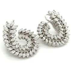 Adorn yourself lavishly with these exquisite statement earrings, crafted with 3.66carat total weight of striking marquise cut diamonds. Indulge in their magnetic shimmer and regal design to elevate any look and occasion into a truly luxurious experience. Each earring is 27mm in length 29mm width and the design is definitely statement making. Metal: 18K White GoldDiamond Weight: 78 Marquise Cut diamonds 3.66ct twBacking: Clasp Back Dimensions: 24mm x 24mm Regal Design, Marquise Cut Diamond, Marquise Cut, White Gold Diamonds, Statement Earrings, Gold Diamond, Diamond Cuts, Fine Jewelry, Diamonds