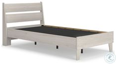 a white bed frame with wooden slats and black foot board on the bottom side