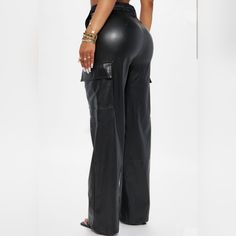 Flaunt Your Style With The Tina Cargo Pants! Made From Buttery-Soft Faux Leather And Featuring Four Functional Side Pockets, These Pants Are Perfect For Every Occasion. Comfort, Quality, And Sophistication These Pants Have It All! 95% Polyester 5% Spandex High Waist Pants With Cargo Pockets For Night Out, Wide Leg Leather Pants With Pockets For Night Out, Full Length Leather Pants With Pockets, High Waist Pants With Side Pockets For Night Out, High-waisted Pants With Pockets For Night Out, Fitted Straight Cargo Pants For Night Out, Night Out High-waisted Pants With Pockets, Leather Trousers With Pockets For Night Out, Leather Pants With Pockets For Night Out