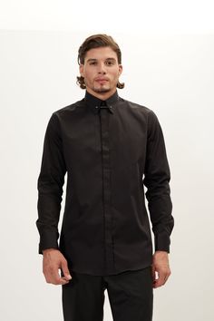 Our hidden placket shirt is tailored from pure cotton-sateen, so it's crisp and breathable. It has an immaculately tailored cutaway collar that accommodates wider ties and fastens with a silver tone tie-bar. The deep black works well with dark suiting. Made with European pure cotton premium 50s single-ply sateen fabric. It is silky and refined. This high thread count makes a shirt that looks great with denim casually, or a clean suited look. Fitted construction 100% Cotton Sateen Made in Turkey Black Collared Shirt For Party, Black Business Shirt With Concealed Placket, Black Business Shirt With Placket, Black Dress Shirt With Button Cuffs For Formal Occasions, Classic Fitted Black Shirt, Black Dress Shirt With Button Cuffs For Work, Fitted Long Sleeve Dress Shirt For Daywear, Black Dress Shirt With Spread Collar For Work, Black Slim Fit Shirt For Formal Occasions