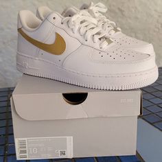 Brand New Never Worn Custom Painted Gold Swoosh White And Gold Nike Shoes, Nike Custom Low-top Gold Sneakers, Nike Custom Gold Low-top Sneakers, Gold Low-top Nike Custom Sneakers, Gold Nike Shoes, White And Gold Shoes, Eras Outfits, Shoes Nike Air Force, Nike Air Women