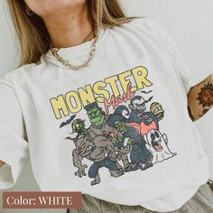 Comfort Colors Distressed Monster Mash T-Shirt: Get into the Halloween spirit with this cute and spooky tee. Featuring a playful monster design, it's perfect for Halloween parties and festivities. The distressed style adds a vintage touch to the graphic tee, making it a stylish and unique addition to your wardrobe. Made with Comfort Colors' comfortable and high-quality fabric, it's perfect for all-day wear. Show off your love for monsters and the Halloween season with this Monster Mash T-Shirt. All clothing and accessories from The Southern Thistle are handmade-to-order, just for you! ☺️  SIZING: Tshirts and sweatshirts are unisex, classic fit. Please refer to size chart in listing photos for details. Easy measuring tip: Take your favorite shirt, lay it on a flat surface and measure the wi Monster Logo Shirt, Lil Monster Tshirt, Pop Culture Cotton Shirt For Halloween, Halloween Pop Culture Cotton Shirt, White Pop Culture T-shirt For Halloween, Cute Halloween T-shirt For Streetwear, Monster Mash Halloween Party, Monster Mash Party, Monster Shirt