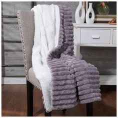 a chair with a blanket on top of it