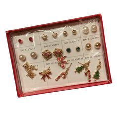 a red box filled with lots of different types of earrings