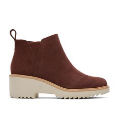 PRICES MAY VARY. Mid wedge bootie with suede uppers and asymmetric toe detail Features removable insole, heel pull tab, side zip, and lateral V gore for easy on and off OrthoLite Eco LT Hybrid insoles made with 26% eco content (15% waste foam, 5% recycled content and 6% bio-oils) EVA wedge outsole with TPR welt Wedge height is approximately 2" and shaft height is approximately 3 1/2" Toms Mallow Boots, Women's Fall Shoes, Autumn Shoes Women, Bio Oil, Recycled Rubber, Suede Wedges, Wide Boots, Leather Products, Fall Shoes