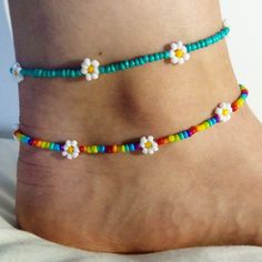 Dainty daisy anklet/ summer anklet/dainty anklet/ rainbow anklet/ rainbow anklet/ trendy jewellery/ cute boho jewellery/ dainty jewelry. Very fragile but beautiful as long as you're careful! Perfect gift for family or friends, or just something for yourself! To measure your anklet size, I suggest taking a piece of string (or a tape measure if you have one) and then measure around your ankle and choose the closest (or slightly larger) option!  If there are any problems please let me know on here or on my Instagram: @lanneaux_jewellery! Colorful Beaded Anklets For Spring Gift, Trendy Summer Anklets With Round Beads, Handmade Trendy Anklets For Spring, Spring Anklets With Colorful Beads, Trendy Handmade Anklets For Spring, Spring Gift Anklets With Colorful Beads, Handmade Rainbow Jewelry For Summer, Trendy Tiny Beads Anklets For Summer, Trendy Summer Anklet With Tiny Beads