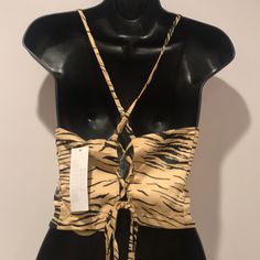 Printed Cropped Top From Urban Outfitters Cut In A Slim Fit With A Tie Closure At The Strappy Back. 97% Polyester, 3% Spandex; Machine Wash; Imported. Bin7-#3 Casual Party Crop Top From Urban Outfitters, Casual Party Crop Top By Urban Outfitters, Trendy Strappy Tops For Day Out, Chic Tiger Print Tops For Spring, Casual Strappy Tops With Tie Back, Chic Strappy Tops For Vacation, Chic Strappy Vacation Tops, Chic Strappy Tie Back Tops, Casual Strappy Crop Top For Party