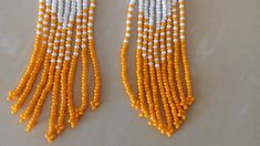 African beaded earrings, Handmade earrings, African jewelry, Maasai jewelry, Earrings for women,Gift for her, Tribal Earrings These stunning earring are superbly crafted which will absolutely makes stand out in any occasion. Color - White and Orange. 3-5 days delivery via DHL Express The shipping fee is for the first item only and additional necklaces or items ship for free. Wholesale available at a fair price,please contact me. For any clarification,please send me a convo or an e-mail. Thank yo Traditional White Dangle Beads, White Beaded Earrings For Festivals, White Beaded Earrings For Festivals Gift, White Beaded Earrings For Festivals And Gifts, White Beads With Ear Wire For Jewelry Making, Traditional White Round Bead Earrings, Traditional White Earrings With Ear Wire, White Dangling Beads Earrings For Festivals, Maasai