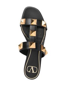 Black leather/lambskin leather Roman Stud mule sandals from VALENTINO GARAVANI featuring gold-tone stud detailing, open toe, branded insole and backless. | Valentino Garavani Roman Stud mule sandals Shoes 2022, Studded Sandals, Mule Sandals, Editing Service, Leather Cleaning, Studded Leather, Leather Care, Lambskin Leather, All About Fashion