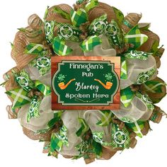 a st patrick's day mesh wreath with a sign that says finnnan's pub