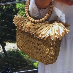 🖐 Hello ⭐Introducing our stunning Wooden Beaded Handle Straw Bag, the ultimate Summer Tote for all your sunny adventures! ⭐This round handle bag is not only fashionable but also authentic handmade, making it a perfect lover gift or a treat for yourself. ⭐It features a fringed clutch detail and is crafted from high-quality crochet raffia, giving it a stylish bohemian vibe. ⭐ The vibrant multi-color design adds a playful touch to any outfit, while the top handle and tasseled accents provide both Summer Beach Beaded Crochet Bag, Bohemian Beaded Crochet Bag For Beach, Beaded Crochet Beach Bag For Summer, Bohemian Beaded Crochet Bag For The Beach, Summer Beach Crochet Bag With Beaded Detail, Summer Beach Crochet Bag With Beads, Bohemian Beaded Crochet Beach Bag, Summer Beige Crochet Bag With Tassels, Beaded Straw Beach Bag