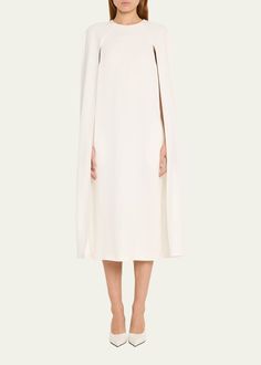 Chic Evening Dresses With Cape Sleeves, Formal Dresses With Structured Shoulders And Cape Sleeves, Evening Dresses With Structured Shoulders And Cape Sleeves, White Dress With Draped Sleeves For Gala, White Gala Dress With Draped Sleeves, Chic Cape Dress For Formal Occasions, White Gala Dress With Cape Sleeves, Elegant Fitted Cape Dress, Cocktail Midi Dress With Draped Cape Sleeves