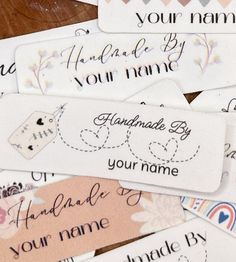 many different types of name tags on a table