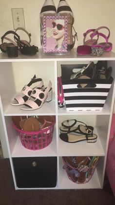 a shelf filled with lots of different types of shoes and purses on top of it