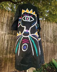 Long black 90s style trench coat ||  Polyester material ||  Lightweight/ comfortable / pockets  Size Small/Medium  Petite arm sleeves ||  Size 13/14 on tag 🖤 Hand painted and sealed design ||  Hand wash only || spot clean Hand Painted Trench Coat, Artistic Black Outerwear For Fall, Artistic Black Long Sleeve Outerwear, Hand Painted Jacket, Style Trench Coat, Black 90s, Painted Jacket, Jacket Outdoor, Trench Coat Style