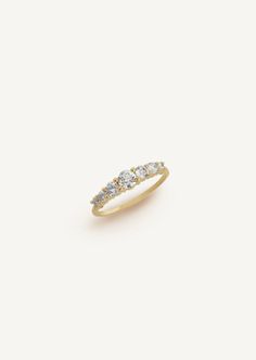 Whether you're celebrating a commitment to a partner or a milestone, this ring is an absolute classic for many years to come. Seven classic prong setting, round brilliant diamonds are framed on a 1.3mm thick gold. 14k solid gold - always Weighs about 1.8grams Band is 1.3mm thick Diamond total weight 0.125, SI1 Clarity We offer custom sizes upon request. Please add the Custom Size request to your cart from HERE. Custom sizes are final sale. Classic Diamond Birthstone Ring With Accents, Timeless Birthstone Ring With Prong Setting, Classic Birthstone Ring With Prong Setting In Cubic Zirconia, Timeless Birthstone Ring With Brilliant Cut, Diamond Birthstone Ring With Prong Setting, Diamond Half Eternity Birthstone Ring For Anniversary, Formal Diamond Birthstone Ring With Half Eternity, Gold Diamond Birthstone Ring With Half Eternity Design, 14k Gold Birthstone Ring With Prong Setting