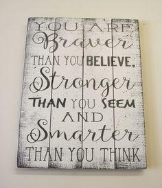 a wooden sign that says you are brave than you believe, longer than you seem and smarter than you think