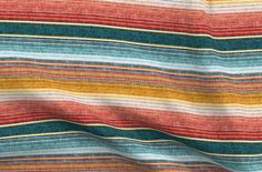 a multicolored striped fabric is shown with measurements for the length and width of it