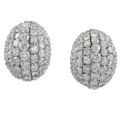 A pair of earrings designed as dome, set with white diamonds and mounted in 18k white gold. Total weight of diamonds is 14.5 carats. G color, VS clarity. Gross weight is 38.35 gr. 1.1 inches long. Luxury Oval Diamond Earrings For Evening, Oval Diamond Cluster Earrings For Formal Events, Oval Diamond Earrings With Accents For Evening, Oval Diamond Earrings For Evening, Diamond White Oval Diamond Earrings In Platinum, Luxury Oval Diamond White Diamond Earrings, Diamond White Round Diamond Earrings For Evening, Luxury Oval Diamond Earrings With Pave Setting, Diamond White Diamond Earrings For Evening