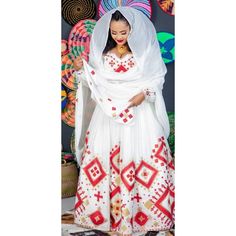 This traditional Ethiopian dress is a true masterpiece of craftsmanship, with its stunning red color and luxurious Menen fabric. The Menen fabric used in this dress is of the highest quality, adding a luxurious feel to the overall design. The vibrant red color of the dress is eye-catching and bold, making a statement wherever you go. The dress features a beautiful and elegant design that highlights the traditional techniques used in its creation. The intricate details of the Menen fabric are com Traditional Maxi Dress For Eid Ceremonies, Traditional Red Maxi Dress For Eid, Traditional Red Festive Maxi Dress, Traditional Red Maxi Dress For Festive Season, Traditional Red Maxi Dress For Festive Occasions, Fitted Habesha Kemis For Eid, Traditional Red Embroidered Maxi Dress, Traditional Red Maxi Dress For Wedding, Traditional Embroidered Red Maxi Dress