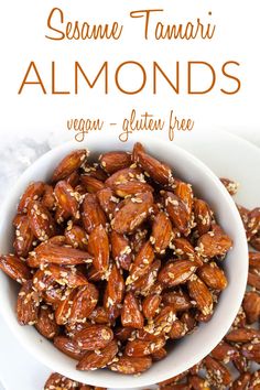 a white bowl filled with almonds on top of a table