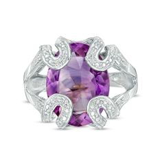 Plan to stand out when you wear this distinct purple amethyst and diamond accent folded ribbon ring - an intoxicating look that makes your unique taste known. Crafted in sterling silver This choice showcases a 16.0 x 12.0mm oval-shaped bright purple amethyst. Diamond-accented and beaded ribbons fold over at the corners of the center stone, creating an eye-catching sculpted frame. The inside of the split shank is rounded for comfort. Ribbon Ring, Resize Ring, Silver Prices, Bright Purple, Split Shank, Oval Stone, Amethyst Stone, Diamond Stone, Stone Settings