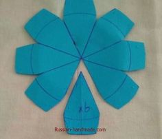 an origami cut out of blue paper