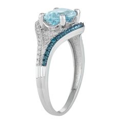 Adorned with a genuine blue topaz center stone accented with blue and white diamonds, this sterling silver ring lends a touch of sparkle to your look.RING DETAILSWidth: 10.9 mmMetal: sterling silverPlating: rhodiumFinish: polishedPackaging: boxedSTONE DETAILSStone type: blue topazTotal weight: 2 1/5 ct.Center stone size: 9 mm x 7 mmShape: ovalSetting: prongDIAMOND DETAILSTotal weight: less than 1/10 ct.Shape: roundColor grade: H-IClarity: I2-I3Setting: prongGemstones may have been treated to enh Blue Birthstone Ring With Diamond Accents For Anniversary, Light Blue Topaz Ring With Diamond Accent Stones, Blue Diamond Birthstone Ring With Accents, Blue Diamond Birthstone Ring With Diamond Accents, Oval Blue Diamond Ring With Pave Setting, Fine Jewelry Blue Topaz Ring In Diamond White, Blue Diamond Ring With Gemstone Accents For Promise, Blue Topaz Jewelry With Pave Setting For Anniversary, Diamond White Blue Topaz Ring Fine Jewelry