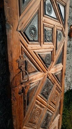 an old wooden door with intricate carvings on it