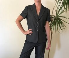 A classic Tahari by Arthur S. Levine pinstriped pantsuit in dark grey. Size 4P. Great quality suite in perfect condition. Womens Suits, Tucson Az, Grey Shorts, Tucson, Suits For Women, Dark Grey, Blazer, Clothes For Women, Grey