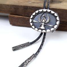 The Guardian Moon Keeper. When there's repairs to be done, this little Guardian Moon Keeper selects which two halves to send up each night. Handmade sterling silver bolo tie with a beautiful flashy blue labradorite gemstone.  Pendant measures 4.2cm by 3.3cm.  Sterling silver cord ends. Comes on dark blue round leather cord. Cord length measures 34 inches Cord thickness is 3mm Includes gift box. Handmade by Silversmith and Lapidary Artist Annie Summers. Annie has recently moved from the UK to the USA and this bolo tie will come in one of her Jewellery FurKeeps gift boxes. Handmade with Love, Forever FurKeeps! We are husband and wife Mike and Annie, making silver jewelry in two uniquely different styles. With a passion for rocks and gemstones, we also cut and polish our own cabochons to use Southwestern Sterling Silver Bolo Tie As Gift, Artisan Silver Jewelry With Adjustable Length, Handmade Sterling Silver Bolo Tie As Gift, Silver Lariat Bolo Tie With Adjustable Length, Silver Lariat Bolo Ties With Adjustable Length, Artisan Silver Lariat Bolo Tie, Adjustable Sterling Silver Lariat Bolo Tie, Southwestern Sterling Silver Bolo Tie, Adjustable Sterling Silver Bolo Tie For Gifts