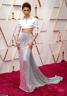 an image of a woman on the red carpet wearing a silver skirt and crop top