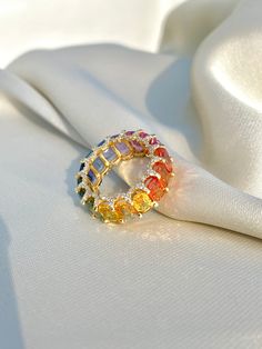 Rainbow Sapphire Ring, 14K Solid Gold, Multicolor Sapphire, Eternity Band Ring, Rainbow Gemstone Ring, Multicolor Band Ring, Gift For Her Diri Jewels 1. Material Details ✧ Gold KT: 14K Solid Gold ✧ Gold Color Options: Yellow Gold, White Gold, Rose Gold ✧ Gemstones: Natural Multi Sapphire (11.00 CTS - final carat weight will depend on ring size) ✧ Natural Diamonds: H-I VS-SI (0.75 CTS - final carat weight will depend on ring size) 2. Shipping & Packaging Details ☐ Dispatches in 4 - 8 business day Luxury Multicolor Cluster Ring As Gift, Multicolor Diamond Ring, Multicolor Oval Ring With Prong Setting, Oval Multicolor Ring With Prong Setting, Multicolor Halo Rings Fine Jewelry, Fine Multicolor Halo Jewelry, Fine Jewelry With Multicolor Halo, Multicolor Halo Rings As A Gift, Multicolor Halo Ring As Gift