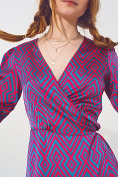 Meet our chic and stylish Mini V Neck Wrap Dress with Geometric Print, a must-have addition to your wardrobe. The dress features a flattering v-neckline and a wrap style that cinches at the waist, and a tie fastening, which create a feminine and flattering silhouette. The geometric print adds a touch of sophistication and modernity to the overall design. Crafted from high-quality satin material, this dress is both soft and comfortable to wear. The fabric is lightweight and breathable, making it Patterned V-neck Maxi Dress With Vibrant Print, Elegant V-neck Maxi Dress With Abstract Print, Vibrant Print V-neck Midi Dress For Party, Multicolor V-neck Mini Dress With Vibrant Print, Chic V-neck Patterned Midi Dress, Chic Patterned V-neck Dress, Patterned V-neck Party Dress, Fitted V-neck Patterned Mini Dress, Spring Mini Dress With Abstract Print And V-neck