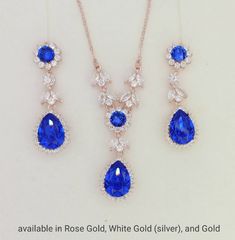 this listing is for a set of necklace and earrings. Can be purchased separately. Necklace: https://www.etsy.com/listing/765604273/royal-blue-wedding-necklace-sapphire?ref=shop_home_active_19&pro=1&frs=1 Earrings: https://www.etsy.com/listing/765604461/swarovski-royal-blue-earrings-sapphire?ref=shop_home_active_18&pro=1&frs=1 Material: Swarovski Majestic Blue crystals, clear cubic ziconia paved findings, plated brass settings. earrings approx 4.2cm long. Necklace length: 43cm, 46c Elegant Royal Blue Jewelry With Prong Setting, Royal Blue Crystal Jewelry For Wedding, Elegant Royal Blue Cubic Zirconia Jewelry, Elegant Blue Crystal Jewelry Sets, Elegant Royal Blue Gemstone Necklace, Royal Blue Jewelry, Brides Mother, Demon Queen, Blue Bridal Earrings