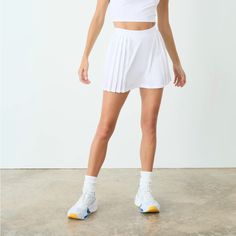 New W Tags Tennis Skirt Casual Pleated Skirt With Built-in Shorts For Spring, Chic White Skirt With Built-in Shorts, White Skirt With Built-in Shorts For Day Out, Sporty Pleated Bottoms For Summer, Sporty Flowy Pleated Skirt, White Pleated Trendy Bottoms, Sporty Summer Pleated Mini Skirt, Sporty White Relaxed Mini Skirt, White Sporty Relaxed Mini Skirt