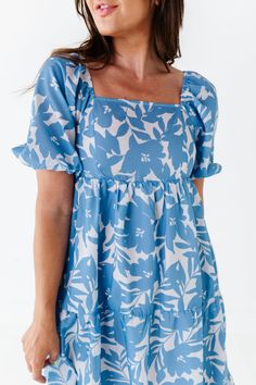 Features Square neckline Puff sleeves with elastic cuff Tiered skirt Ivory with blue floral print Pockets 60% Cotton, 40% Polyester; Lining: 100% Polyester Size + Fit Small 0-4, Medium 4-8, Large 8-12, 1X 12-16, 2X 16-20, 3X 20-24 Kristin is 5'4", a size 1 and is wearing a Small Jayce is 5'6", a size 18 and is wearing a 2X Runs true to size Measurements taken while laying flat and doubled. Bust measurements do not account for stretch. Click here for shoes shown in photos Size Bust Length Small 2 Summer Daywear Puff Sleeve Dress With Floral Print, Summer Puff Sleeve Dress With Floral Print For Daywear, Blue Flowy Puff Sleeve Dress For Spring, Casual Summer Puff Sleeve Dress With Floral Print, Blue Puff Sleeve Dress With Ruffle Hem For Spring, Blue Puff Sleeve Dress With Lantern Sleeves For Spring, Blue Lantern Sleeve Puff Dress For Spring, Casual Floral Puff Sleeve Dress For Spring, Floral Print Puff Sleeve Summer Dress