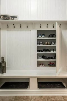 the mud room is clean and ready to be used as a shoe storage area for shoes