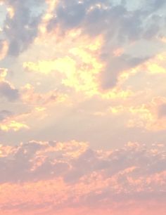 two airplanes flying in the sky at sunset