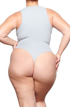 Sculpt your body's natural shape with a high-neck bodysuit from Kim Kardashian West's SKIMS that holds you in and lifts you up in all the right places. Reflecting the brand's passion for highly technical shapewear solutions for every body, this everyday piece has whisper-soft, seamless construction, high-cut legs and a thong back that remains invisible under clothing. Snaps between legs Crewneck Sleeveless Lined 76% polyamide, 24% elastane Machine wash, tumble dry Imported Women's Clothing Shapewear Bodysuit With High-cut Leg And Lined Body, Shapewear Bodysuit With High-cut Leg, Stretch Bodysuit With Built-in Bra And High-cut Leg, Second-skin High-cut Leg Shapewear Bodysuit, High Cut High Stretch Bodysuit With Built-in Bra, Seamless High-cut Leg Shapewear Bodysuit, Seamless Shapewear Bodysuit With High-cut Leg, Seamless High-cut Leg High Stretch Bodysuit, Seamless High-cut High-stretch Bodysuit