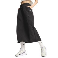 Enjoy the city in style. This versatile midi skirt keeps you comfortable yet chic with multiple pockets to stash your essentials. An elasticated waist and side slits offer a flattering, flexible fit for wherever the day takes you. $59.95 Cargo Midi Skirt, Womens Puma, Black Midi Skirt, Skirt Pattern, In Style, Casual Skirts, The City, Knee Length, Midi Skirt