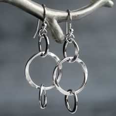 "These simple circle earrings are handmade with nickel free Argentium Sterling Silver. Designed to be lightweight and comfortable to wear, each circle is carefully formed, soldered and hand hammered for just the right amount of texture and dimension. These are given a high polish to catch and reflect the light perfectly. The perfect throw on and go earrings that look great with everything! * Total length include the ear wire from top to bottom is 1.65\" (42mm) * The drop from the bottom of the e Everyday Earrings Silver, Silver Circle Earrings, Sterling Silver Dangle Earrings, Argentium Silver, Everyday Earrings, Brass Jewelry, Circle Earrings, Handmade Sterling Silver, Pure Silver