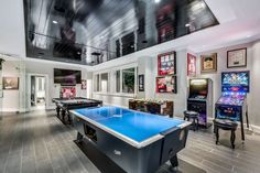 a pool table in the middle of a game room