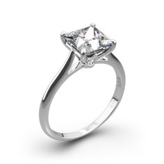 a white gold ring with a princess cut diamond in the center, on a white background