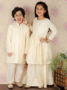 Viscose Cream Mirror Traditional Sibling Set Off White Sets With Chikankari Embroidery For Party, Off White Sets With Zari Work For Transitional Season, Festive Off-white Gota Work Sets, Festive Off White Sharara For Party, Unstitched Off White Sets For Festive Occasion, Festive Off White Straight Kurta Set, Traditional Cream Anarkali Set For Party, Unstitched Off White Festive Sets, Festive Off White Sets With Straight Kurta