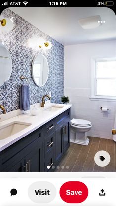 a bathroom with blue and white tiles on the walls, two mirrors above the sink